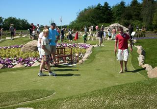 People playing adventure golf
