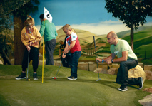 Family playing Adventure Golf