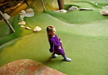 Girl walking across fairway