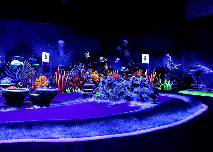 Glowing adventure golf reef with fish