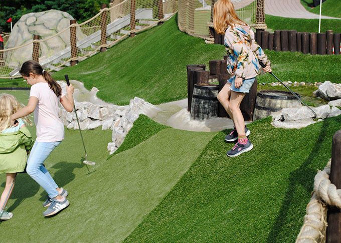 Kids playing golf